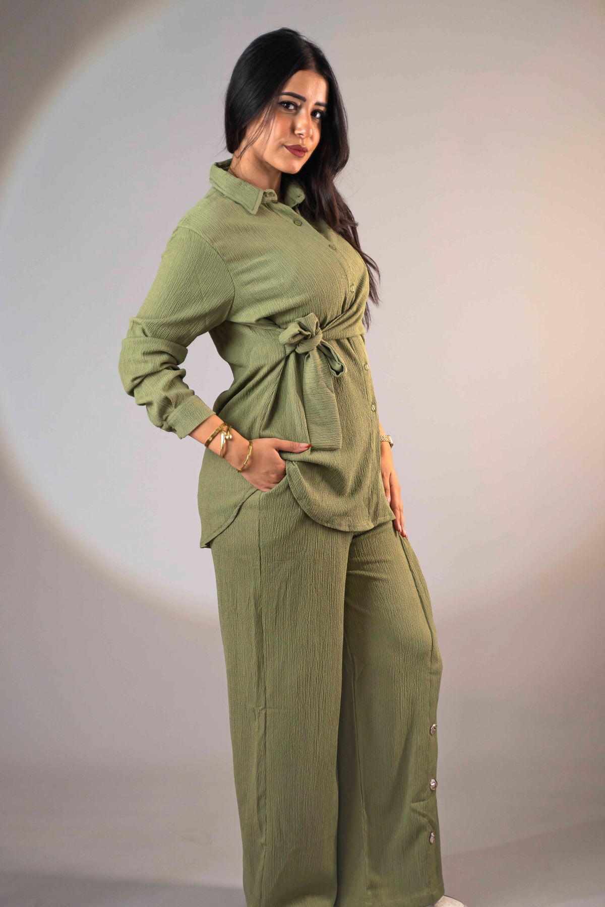 Olive green suit with a side-tie design