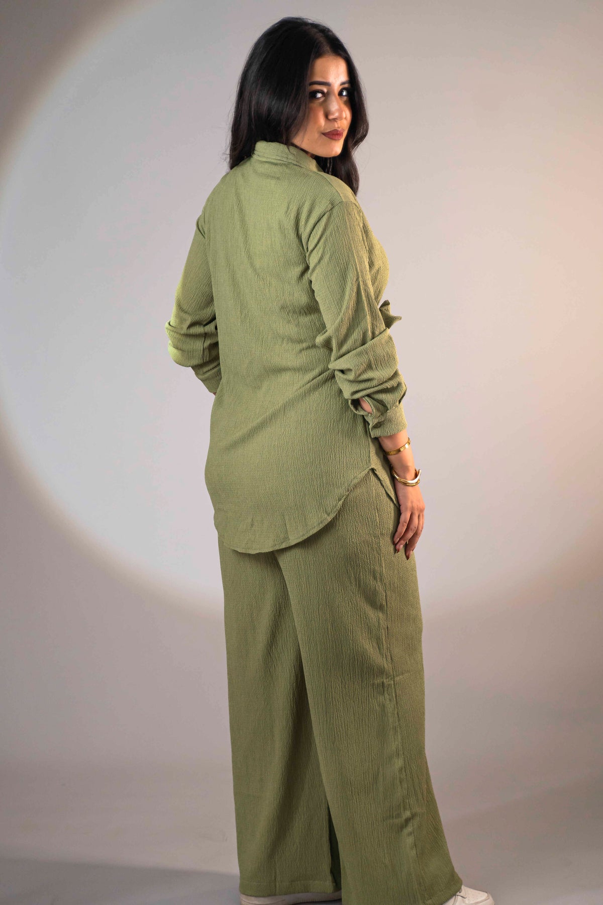 Olive green suit with a side-tie design